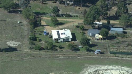 Forensic crews found two firearms at the scene. (9NEWS)
