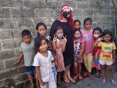 Let's Help Bali founder Amanda with some of the children she has helped