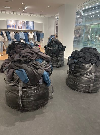 Kanye West defends selling his new clothing line out of construction bags.