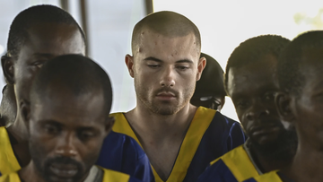 Three Americans accused of being involved in last month&#x27;s coup attempt in Congo appeared in a military court in the country&#x27;s capital, Kinshasa, on Friday, along with dozens of other defendants who were lined up on plastic chairs before the judge on the first day of the hearing.