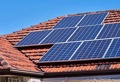 Solar panels on top of house (Getty)