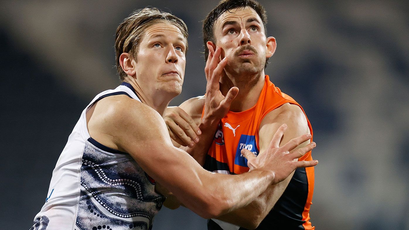 Rhys Stanley of the Cats and Zach Sproule of the Giants compete in a ruck contest during the 2021 AFL Round 21 match between the Geelong Cats and the GWS Giants at GMHBA Stadium on August 6, 2021 in Geelong, Australia. (Photo by Michael Willson/AFL Photos via Getty Images)