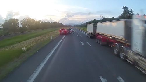 The car is forced to merge early to avoid the oncoming truck.