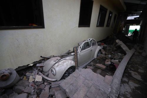 A car sits crushed in  Jojutla, Morelos state. (AP)