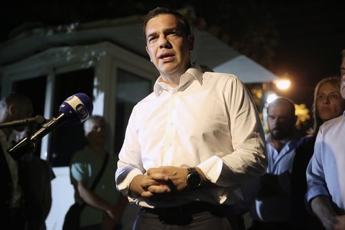 Greek Prime Minister Alexis Tsipras speaks to the media during his visit to the fire brigade's operational center in Athens. Picture: AP