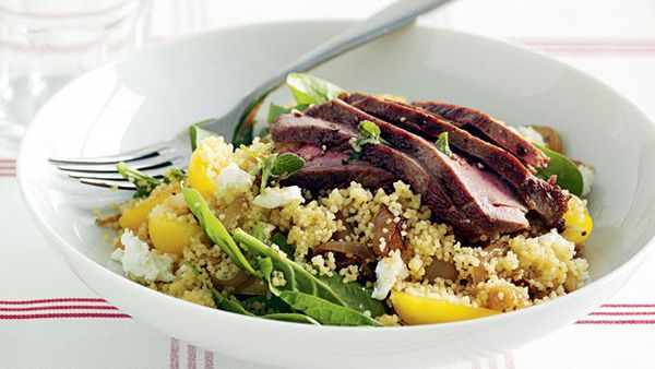 Warm lamb couscous salad with baby spinach