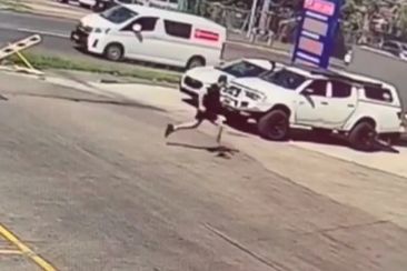 The man then ran through a petrol station car park.