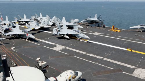 Fighters on the flight deck of the USS Carl Vinson. (AP).