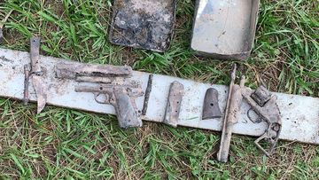 Weapons found in a metal tin during a Clean Up Australia Day event in Brisbane.