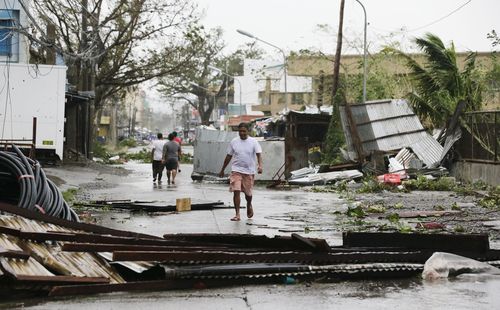 A resident surveys the damage in Tuguegarao city in Cagayan province, north-eastern Philippines.