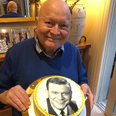 Patti Newton gives her husband Bert Newton a cake on his 82nd birthday.