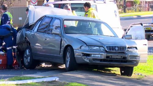 Sydney two-vehicle crash results in couple being hit by their own car