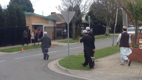 Family and friends arrive for Numan Haider's funeral. (9News)