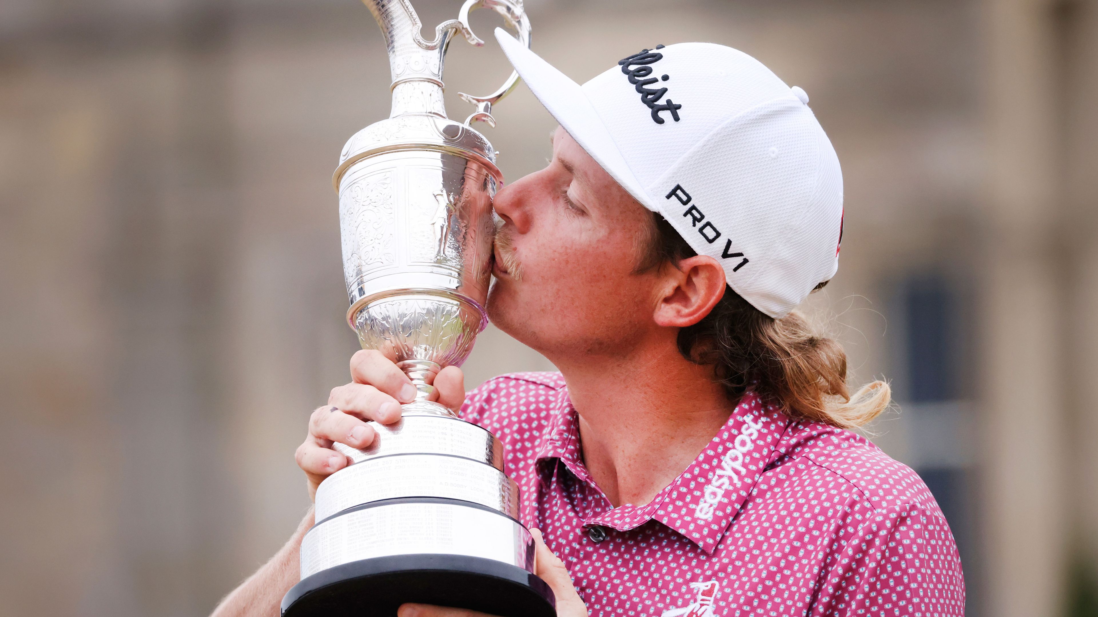 Cameron Smith kisses the claret jug while posing for photographers after winning the British Open golf Championship on the Old Course at St. Andrews, Scotland, Sunday July 17, 2022. (AP Photo/Peter Morrison)