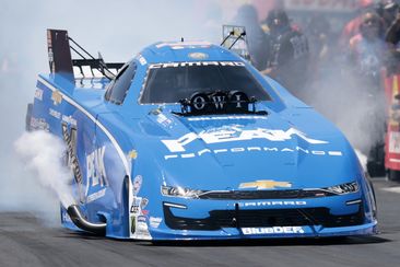 John Force, of Yorba Linda, CA, driving a JFR 500 Peak Chevy &#x27;22 Camaro SS smokes the tires in Fuel Funny Car qualifying during the NHRA New England Nationals on June 2, 2024, at New England Dragway in Epping, New Hampshire. (Photo by Fred Kfoury III/Icon Sportswire via Getty Images)