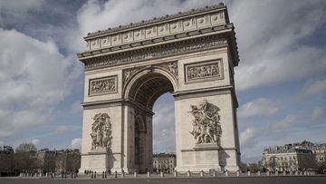 The Arc de Triomphe is deserted after French President Emmanuel Macron has declared a ban on all gathering of more than 100 people and the closure of all schools, restaurants, bars, cafes and clubs in response to the spread of the coronavirus.