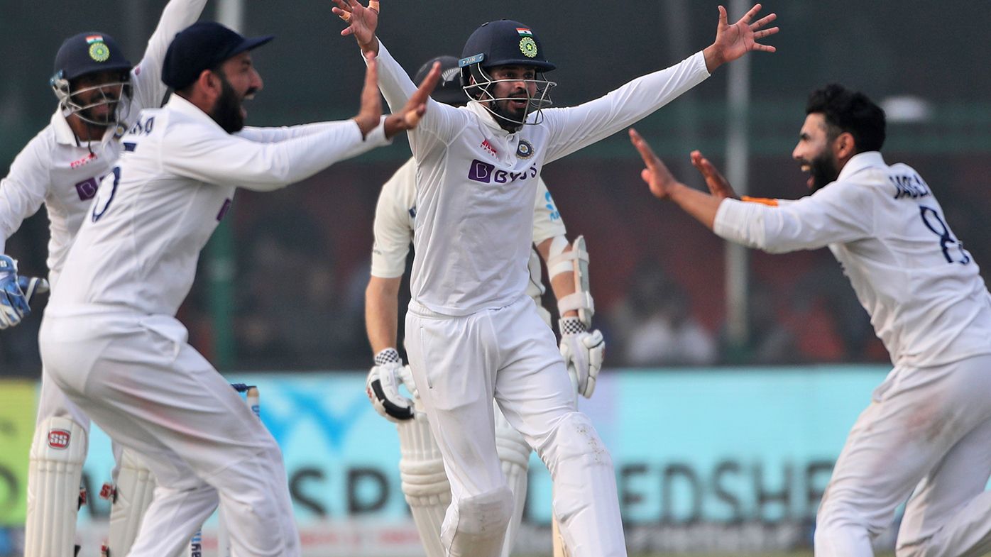 Indian celebrates the wicket of New Zealand&#x27;s Kane Williamson on the final day of the first Test.