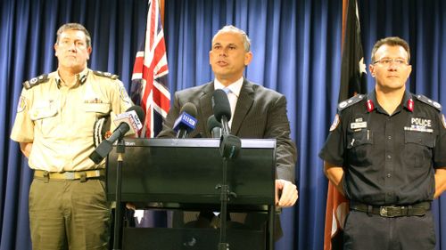 NT Chief Minister Adam Giles (centre), flanked by Corrections Commissioner Mark Payne (left) and Police Commissioner Reece Kershaw. (AAP)
