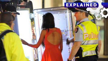 Drunk woman being arrested in Victoria.