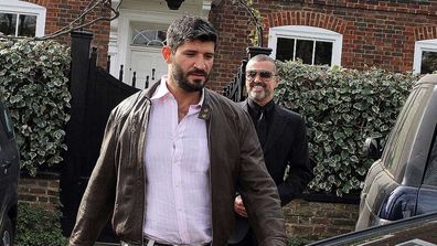 George Michael and Fadi Fawaz are seen leaving the London abode in 2012.