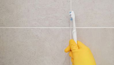 Cleaning bathroom titles and grout.
