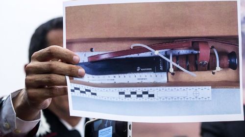 Carabinieri Colonel Lorenzo D'Aloia shows a picture of knife reportedly used to stab and kill Carabinieri officer Mario Cerciello Rega, during a press conference in Rome.