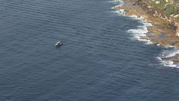 Search underway as a man is missing after a boat capsized in Sydney Harbour this morning