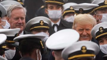 Mark Meadows (left, unmasked) was chief of staff while Donald Trump supporters stormed the Capitol.