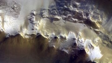 In this image provided by the European Space Agency, ESA, The ExoMars Colour and Stereo Surface Imaging System, CaSSIS, captured this view of the rim of Korolev crater on 15 April 2018. (AAP)
