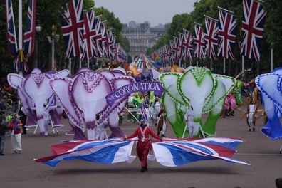 People parade during the Platinum Jubilee Pageant outside Buckingham Palace in London, Sunday, June 5, 2022, on the last of four days of celebrations to mark the Platinum Jubilee 