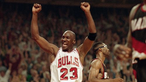Michael Jordan celebrates the Bulls win over the Portland Trail Blazers in the NBA Finals in Chicago on June 14, 1992. (AP Photo/John Swart, File)