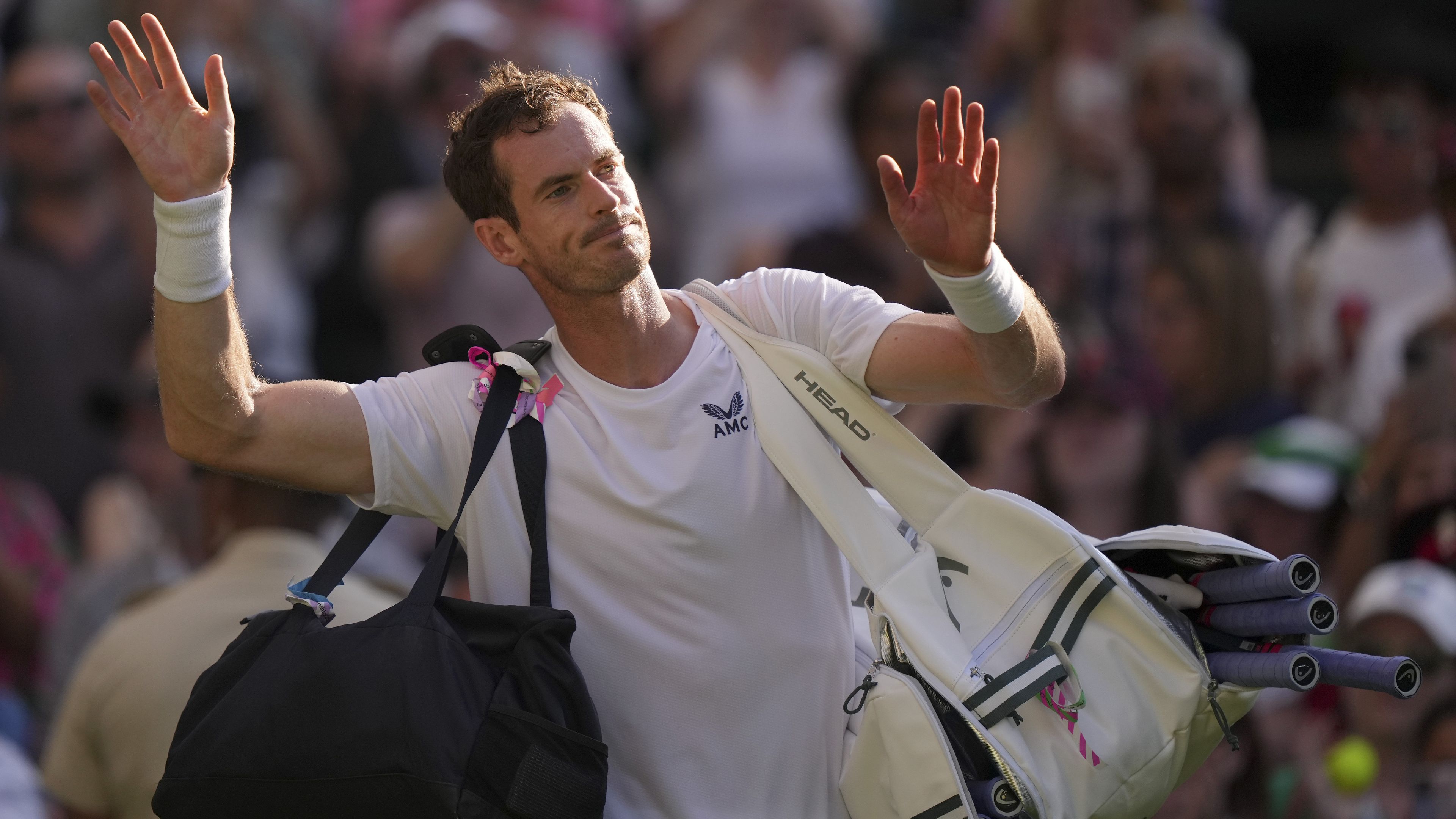 Britain&#x27;s Andy Murray leaves the court after losing to Stefanos Tsitsipas of Greece at Wimbledon.