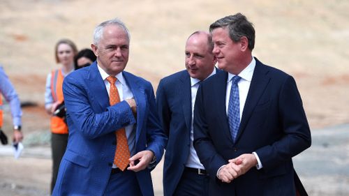 Malcolm Turnbull (left) and the Member for Petrie Luke Howarth (centre) and Queensland LNP leader Tim Nicholls visit the Gateway Upgrade North Project in Brisbane.