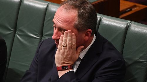 Joyce was seen with his head in his hands multiple times in parliament yesterday afternoon after making the announcement. (AAP)