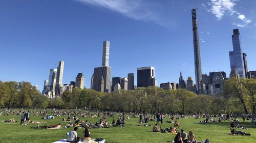 People practice social distancing while enjoying the nice weather at Central Park's Sheep Meadow, Saturday, May 2, 2020,  in New York. 