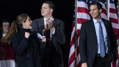 Counselor to the President Hope Hicks cheers as President Donald Trump speaks during a campaign rally last week.