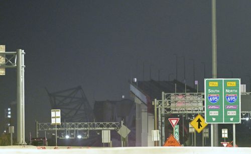 Parts of the Francis Scott Key Bridge remain after a container ship collided with a support Tuesday, March 26, 2024, in Baltimore. 