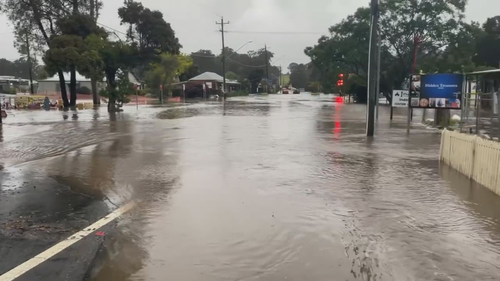 The town centre of Mogo has been inundated with floodwaters. 