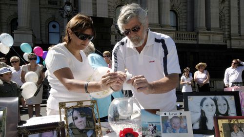 Mr Russouw's parents Lorna and Cecil at a victims of crime rally in Melbourne in 2009. (AAP)