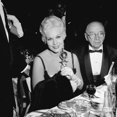 Kim Novak receives the Golden Globe Award for New Star of the Year at the Golden Globe Awards in Los Angeles, California, 1955