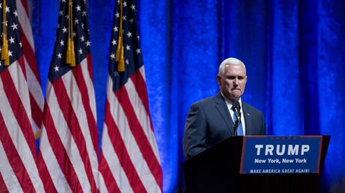 Pence steps behind the Trump podium in New York. (AAP)