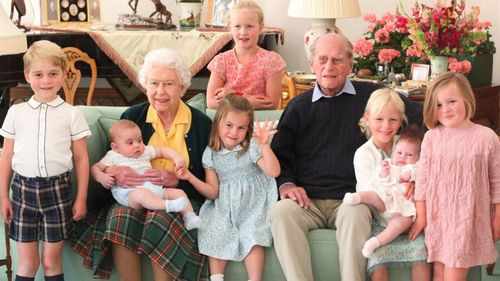 The Queen and Prince Philip surrounded by seven of their great-grandchildren at Balmoral Castle in 2018 (L-R front: Prince George, Queen with Prince Louis, Princess Charlotte, Prince Philip, Isla Phillips, Lena Tindall, Mia Tindall. Back: Savannah Phillips)