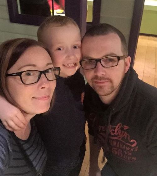 Jack, age eight, with his mum and dad. 