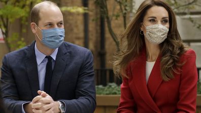 Prince William and his wife Kate the Duchess of Cambridge meet pharmacist Joyce Duah as they visit St. Bartholomew's Hospital in London, to mark the launch of the nationwide 'Hold Still' community photography project, Tuesday, Oct. 20, 2020