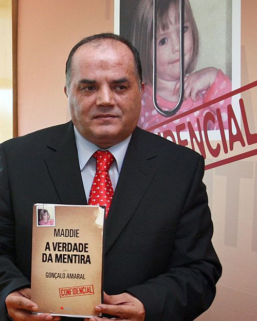 Former detective Goncalo Amaral poses with his book, titled in English as The Truth of the Lie, in July 2008.