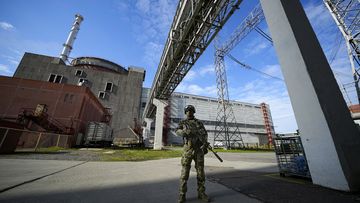 A Russian serviceman guards in an area of the Zaporizhzhia Nuclear Power Station in territory under Russian military control, southeastern Ukraine, on May 1, 2022. 