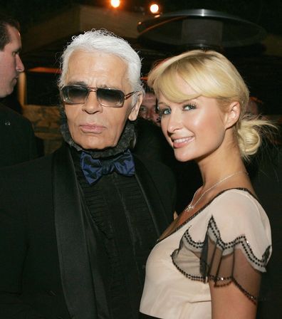 BEVERLY HILLS, CA - JUNE 2:  Designer Karl Lagerfeld (L) and Paris Hilton pose at the International Launch of Dom Perignon Rose Vintage 1996 Champagne by Karl Lagerfeld on June 2, 2006 in Beverly Hills, California. (Photo by Kevin Winter/Getty Images)