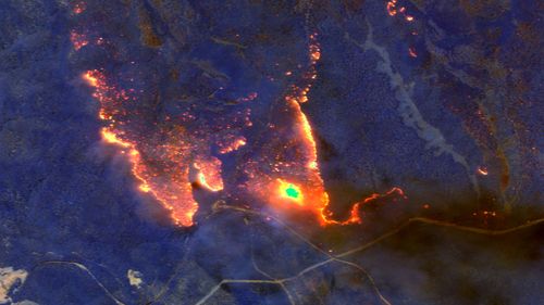 A satellite image shows wildfires burning east of Orbost.