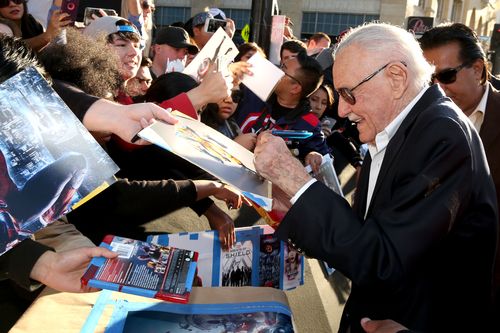 Stan Lee signs autographs as he arrives at the Los Angeles premiere of Captain America: Civil War in 2016. (AAP)