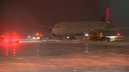 Plane carrying NFL team slides off taxiway